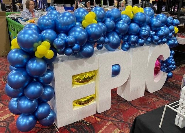 An organic garland wrapping letters that spell EPIC.