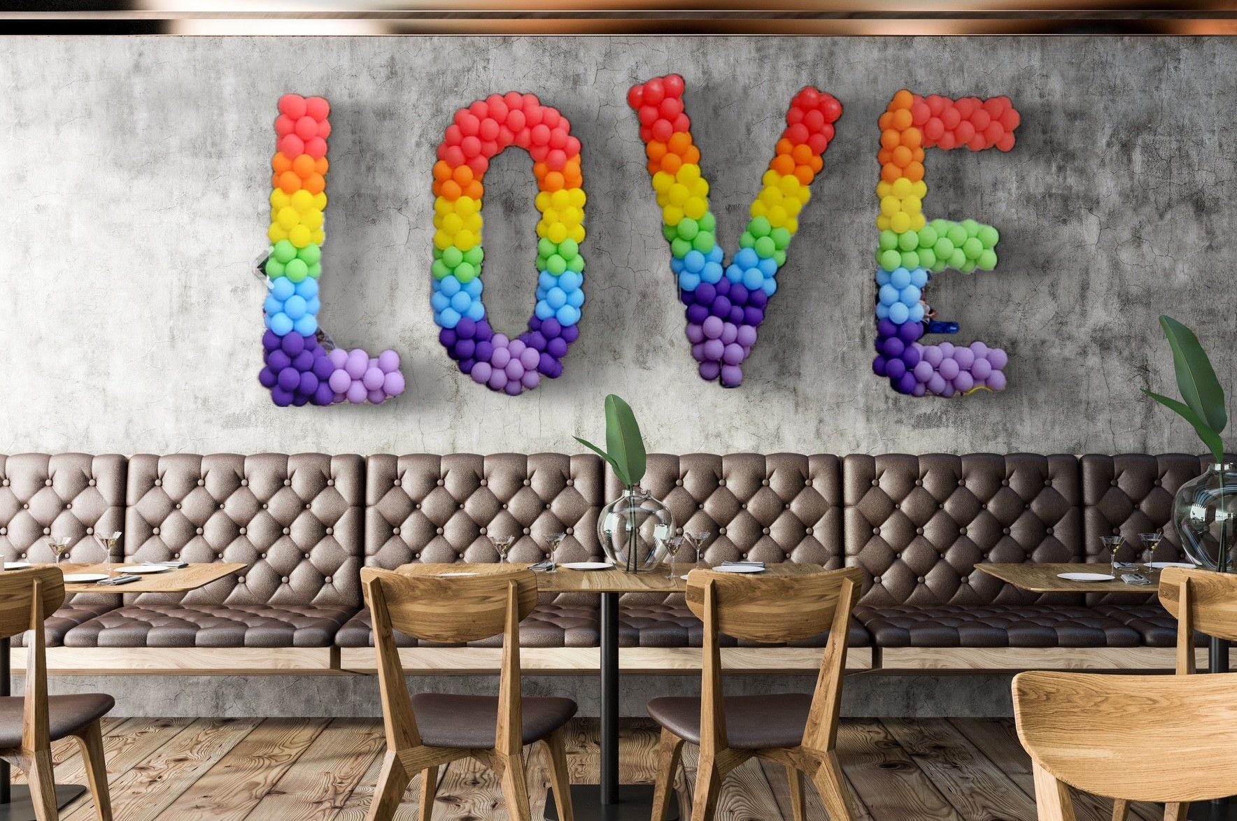 A photo of a balloon mosaic spelling LOVE created by Event and balloons in Hollywood FL.