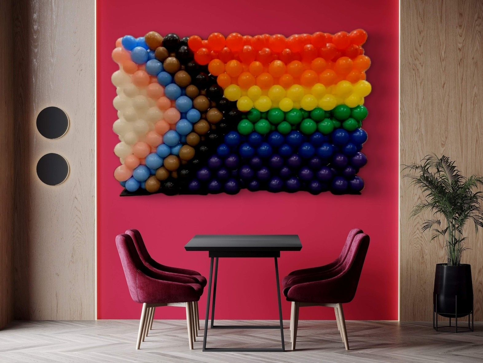 A cafe setting with a linked LGBQT+ flag on the wall above the table.