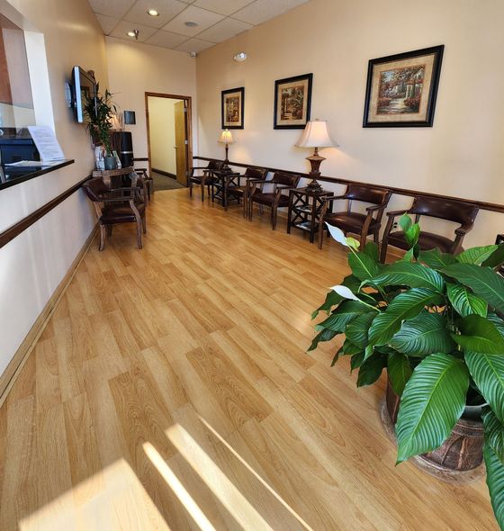 A dental office with a desk and a chair