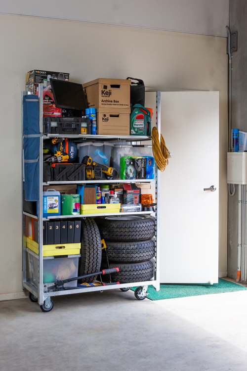 A close up of a metal ladder against a wall.