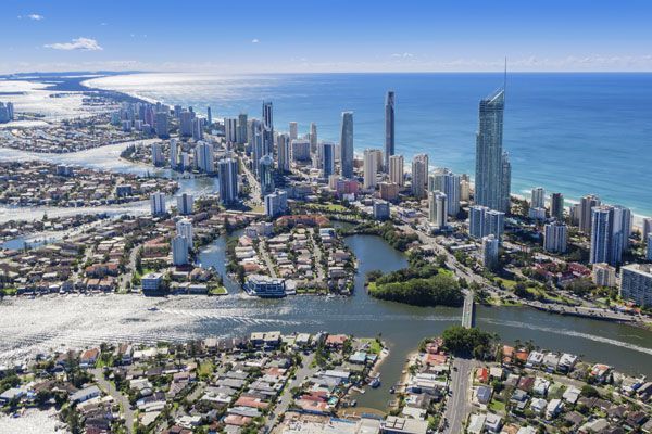 An aerial view of a city surrounded by water and buildings.