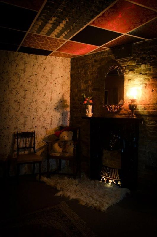 Inside a cozy looking room, much like a living room. The first Little Nan's bar Deptford