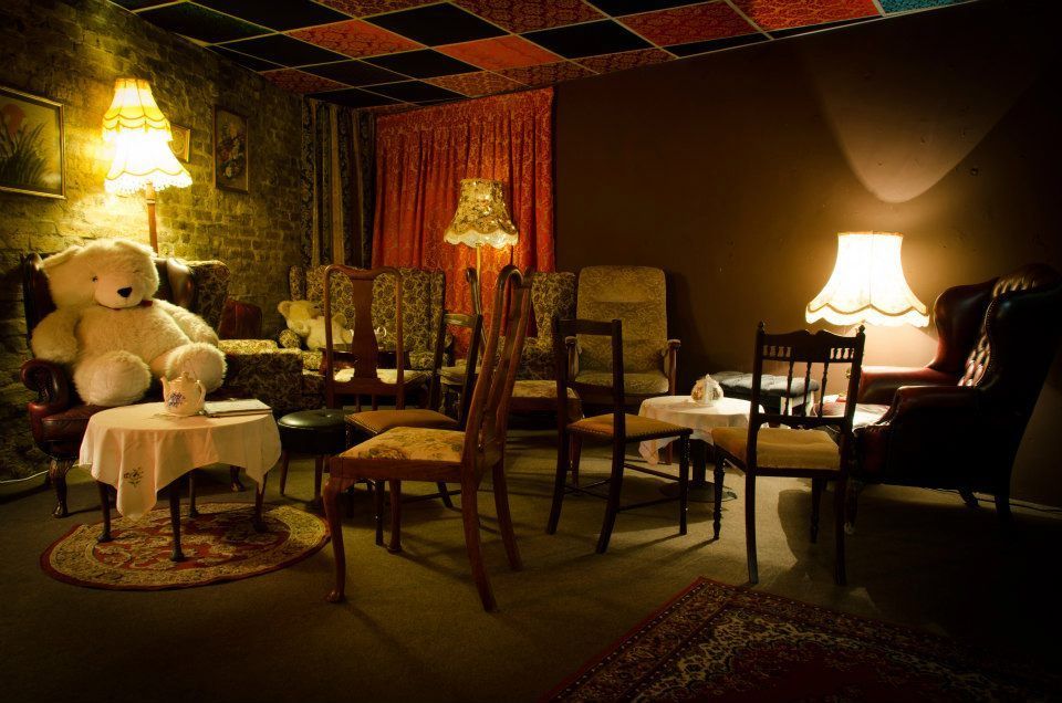 Inside a cozy looking room, much like a living room. The first Little Nan's bar Deptford