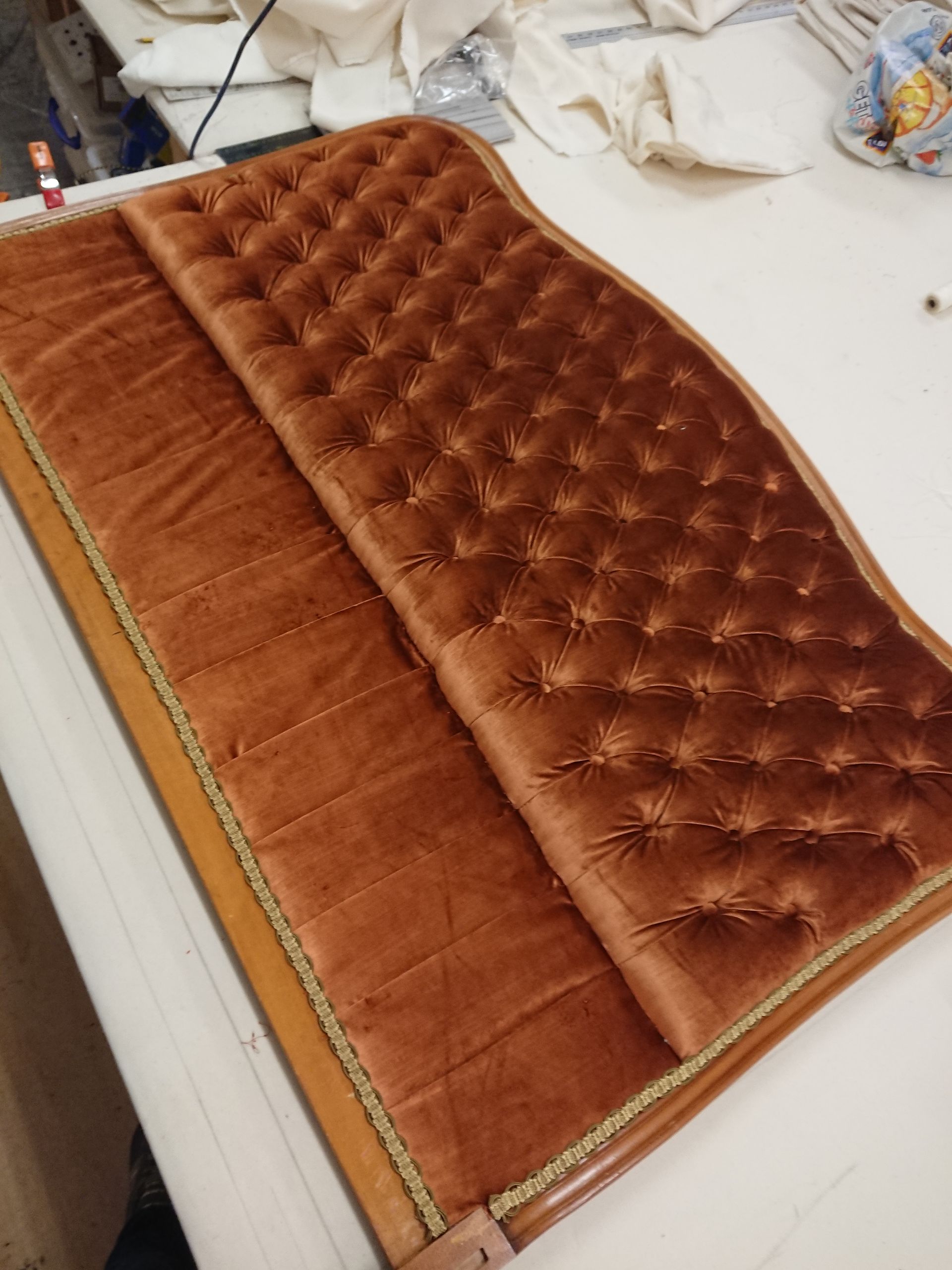 A fancy velvet headboard.