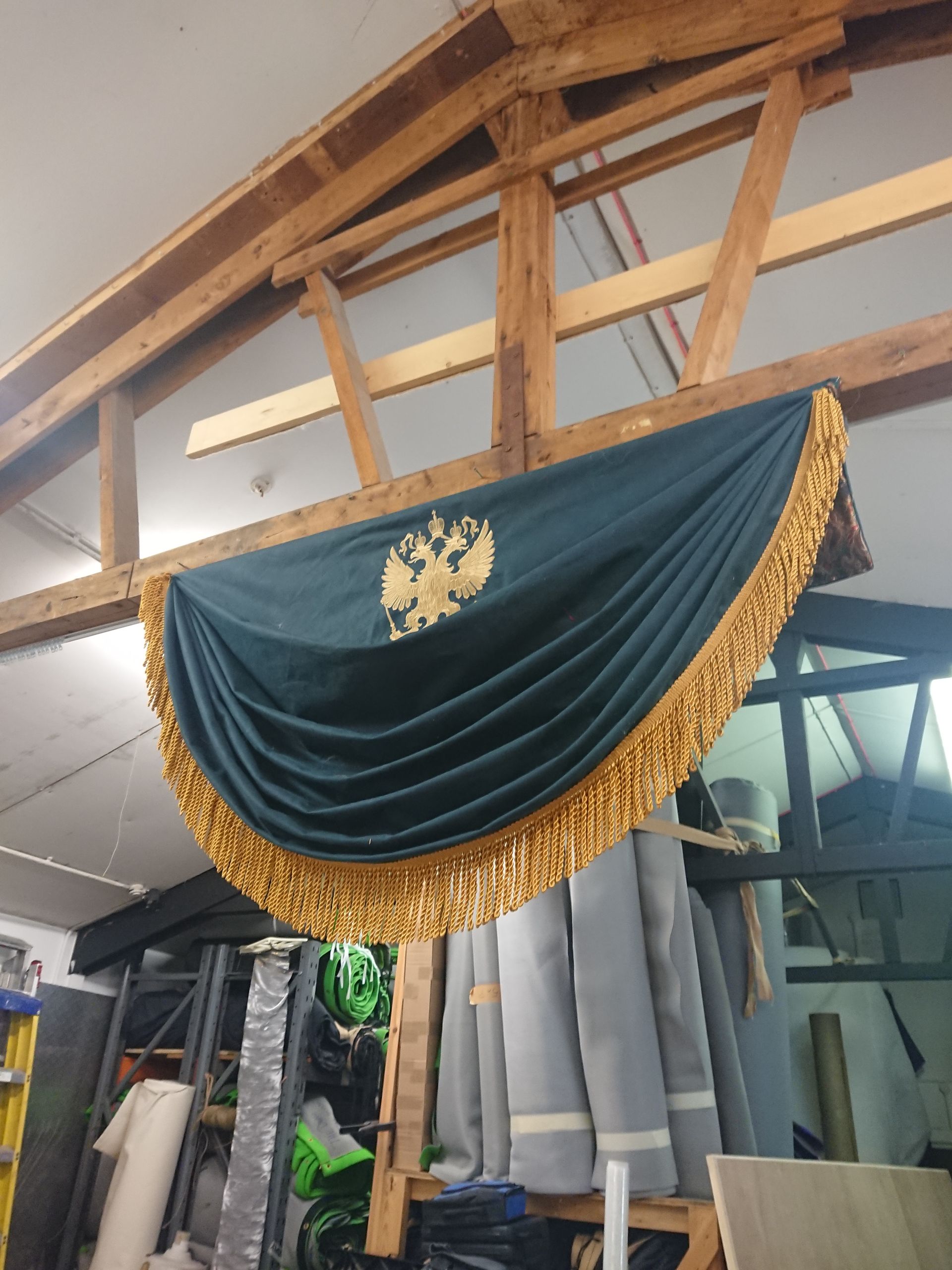 A swag emblazoned with a gold logo. Made for 