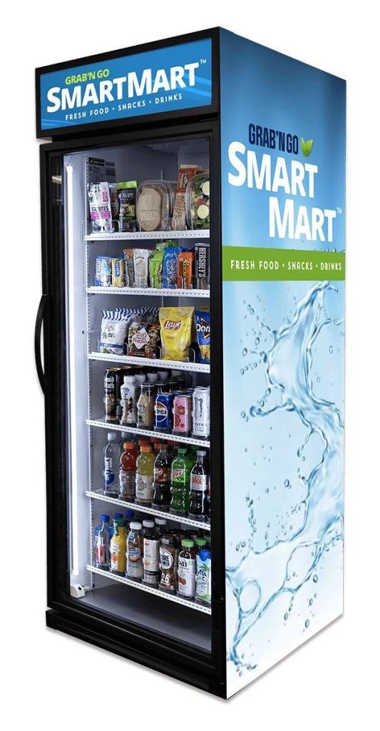 A SmartMart refrigerated vending machine with various food and beverage items for sale.