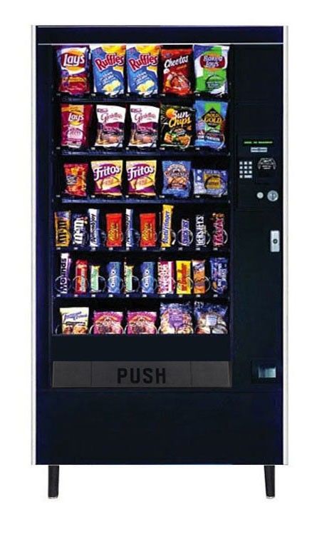 Black vending machine filled with various snack foods, with a 