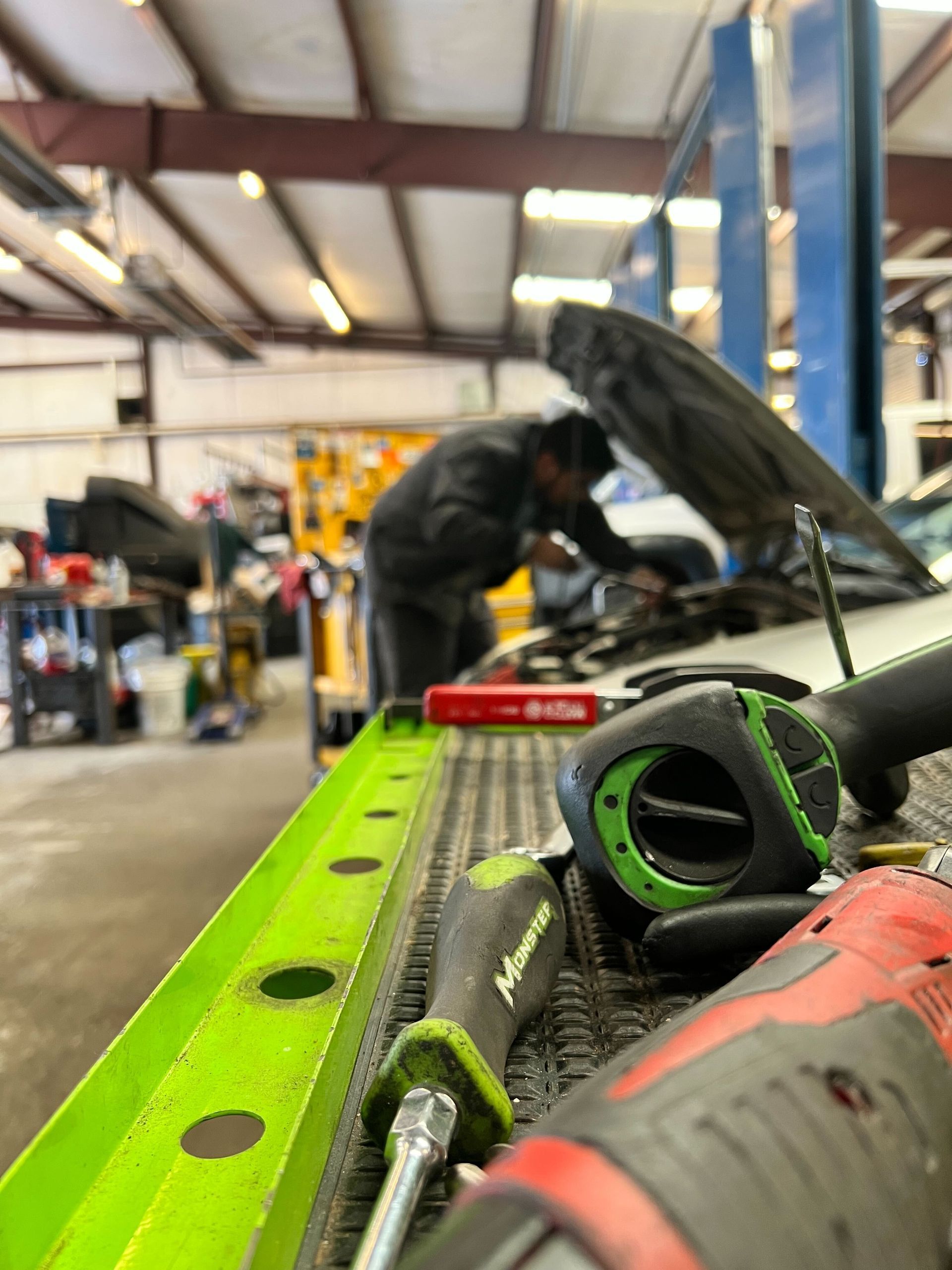 Team Working on a Car | Mango Automotive