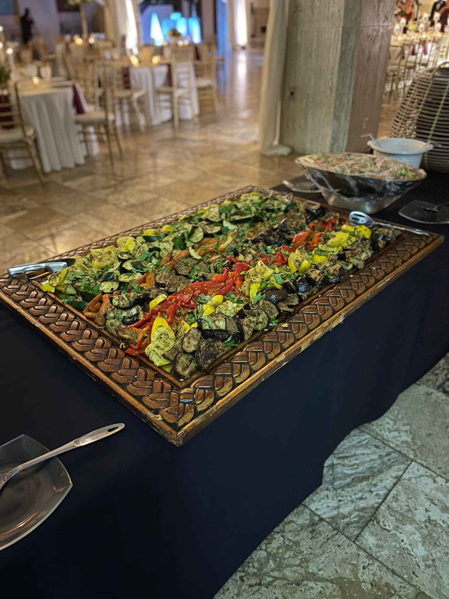 A large tray of food is sitting on top of a table.