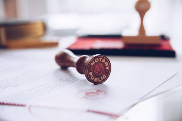 A notary public stamp is sitting on top of a piece of paper.