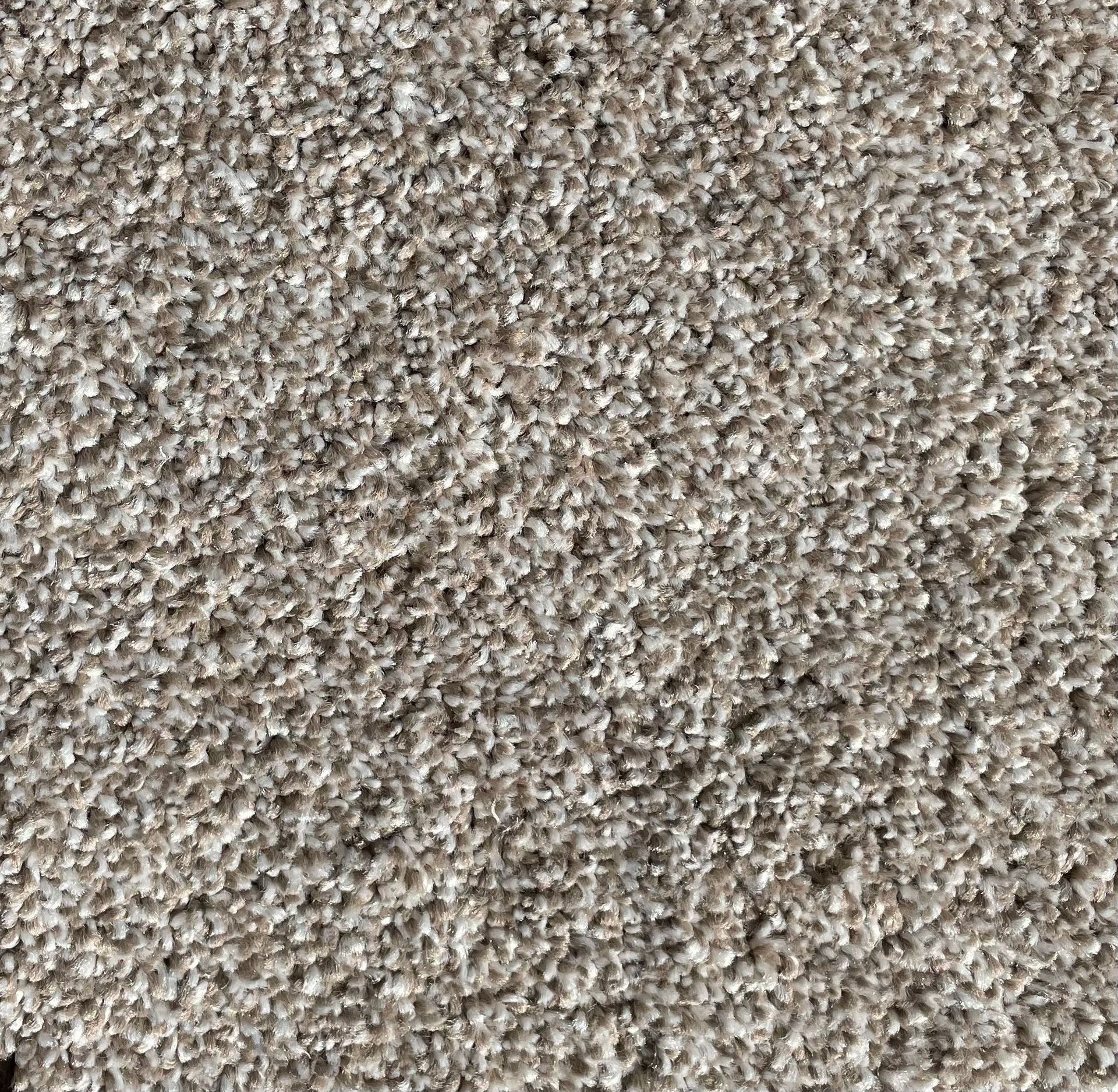 A close up of a carpet with a lot of small dots on it.