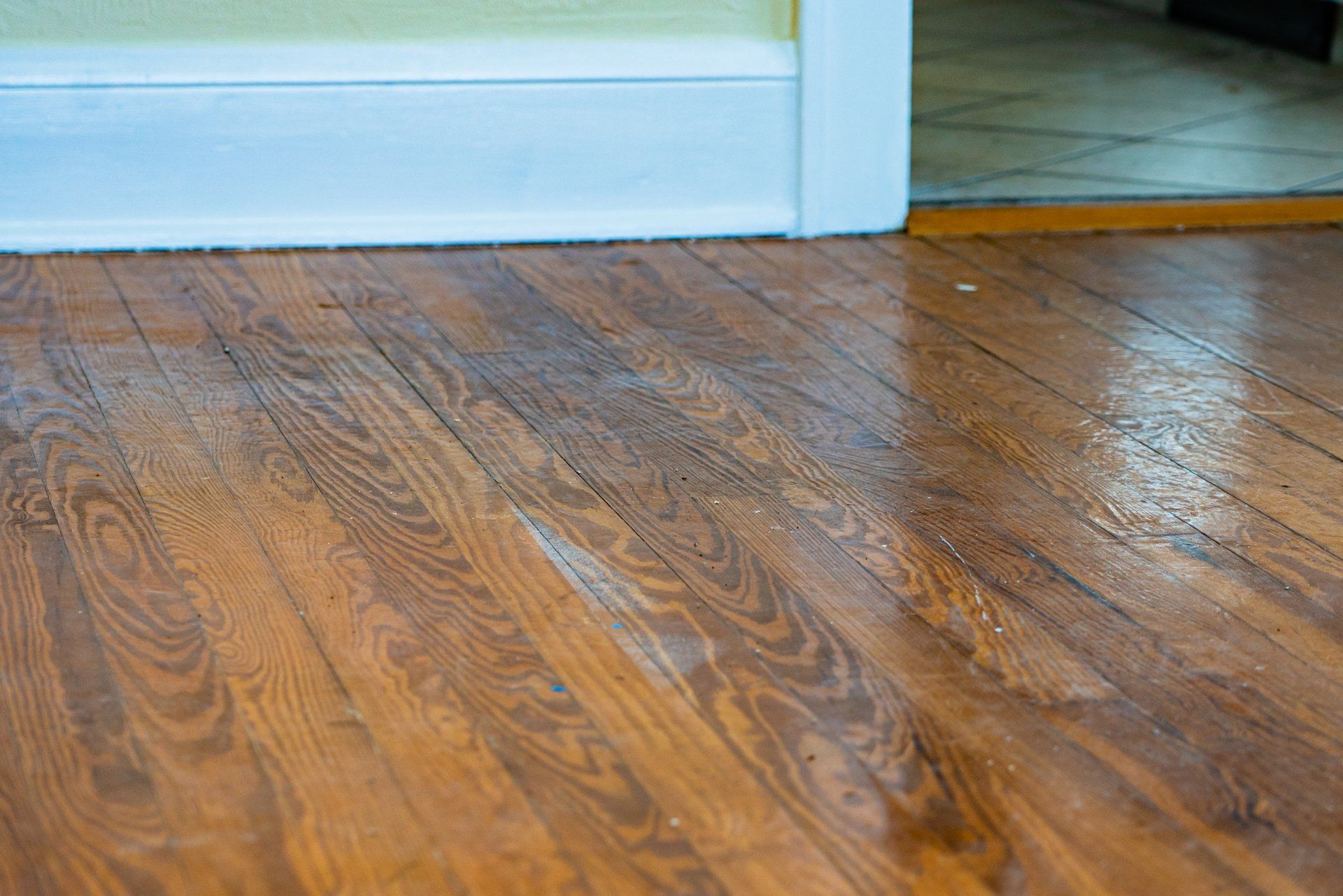 A close up of a wooden floor in a room.