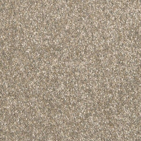 A close up of a carpet with a lot of small stones on it.