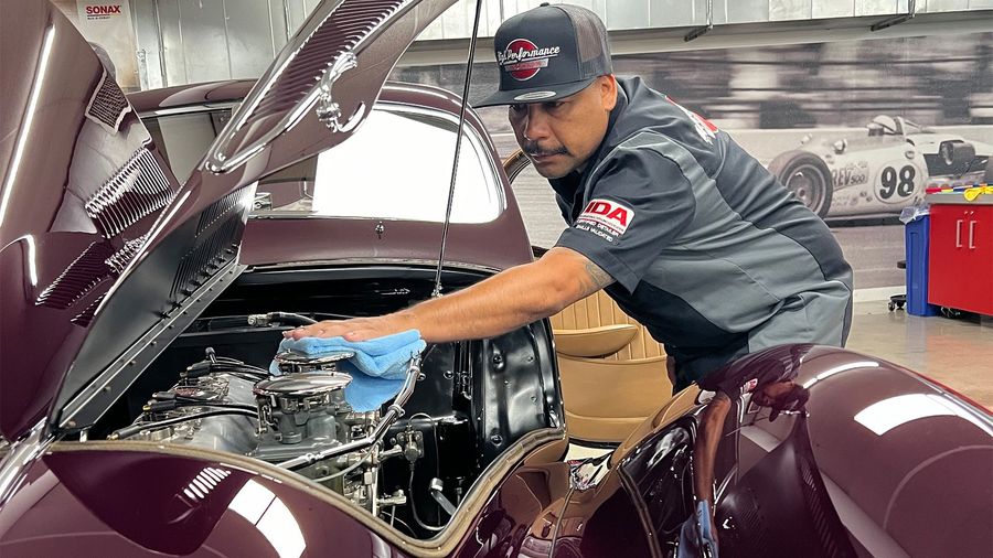 A group of men are posing for a picture in a room.