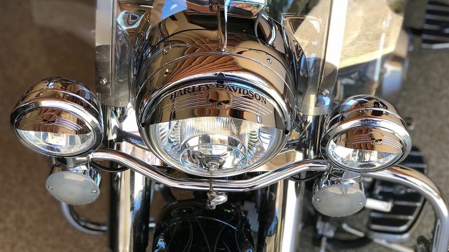 A group of men are posing for a photo in front of a peterson tent