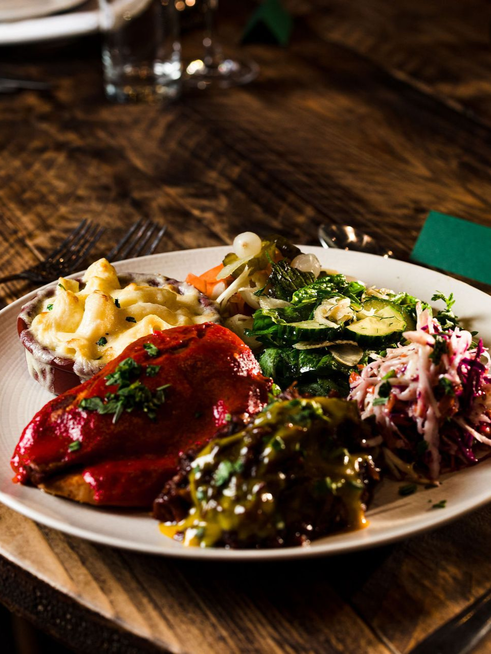 Plate of assorted colorful tapas on a wooden table