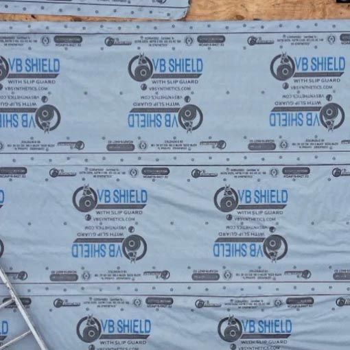 A sheet of vb shield sitting on top of a wooden surface