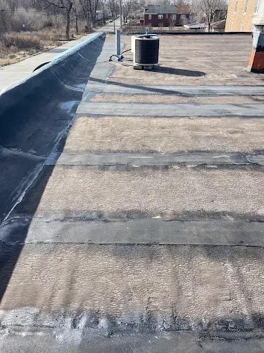 A roof with a chimney on top of it.