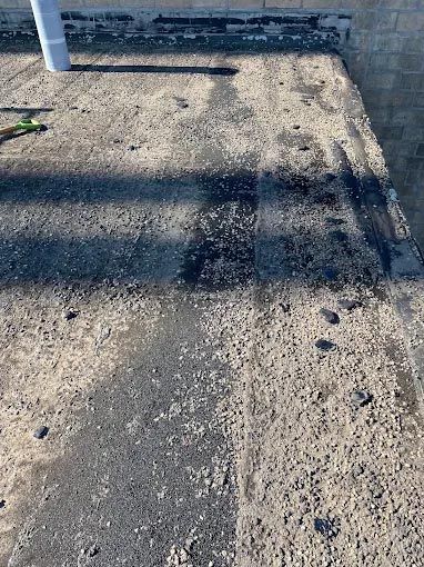 A close up of a concrete surface with a hole in it.