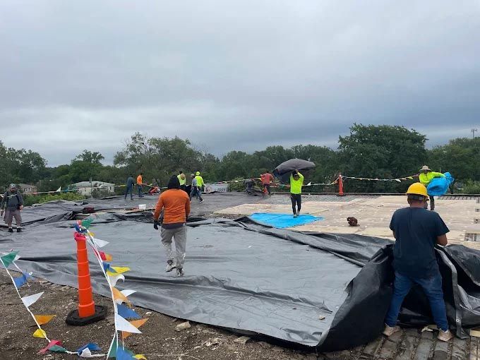 A group of people are working on a construction site.