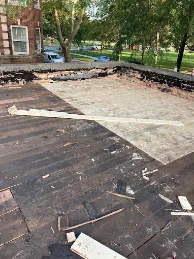 A roof with a lot of pieces of wood on it.