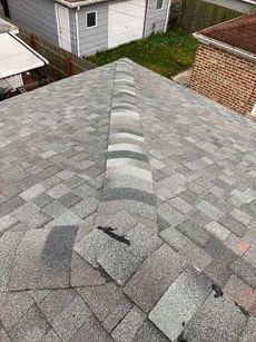 A close up of a roof with shingles on it.