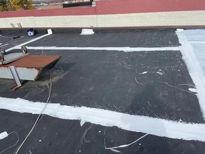 A black roof with white lines painted on it