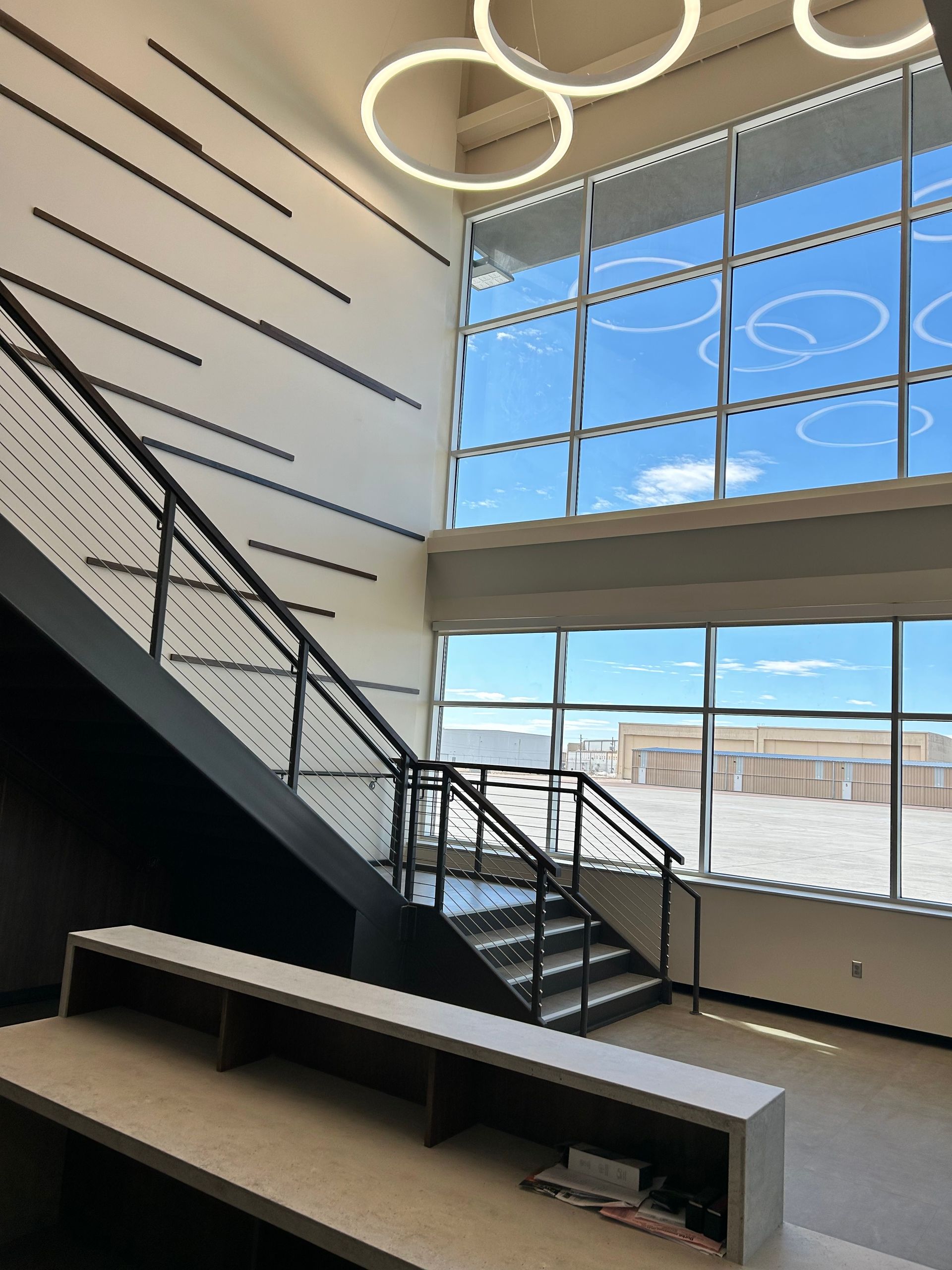 a staircase in a building with a lot of windows | Sioux City, IA | L&L Builders Co