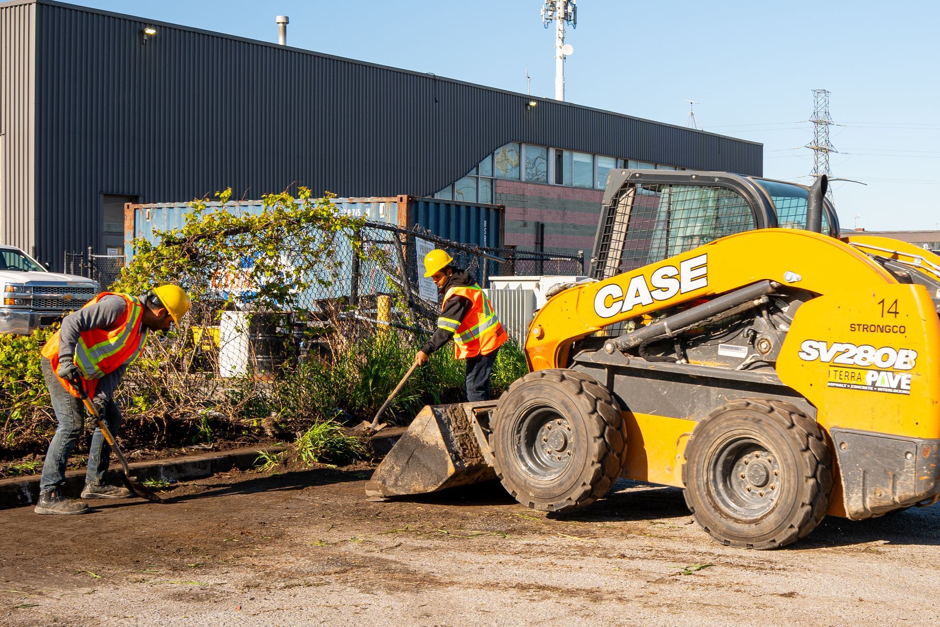 A group of construction workers are working on a construction site.