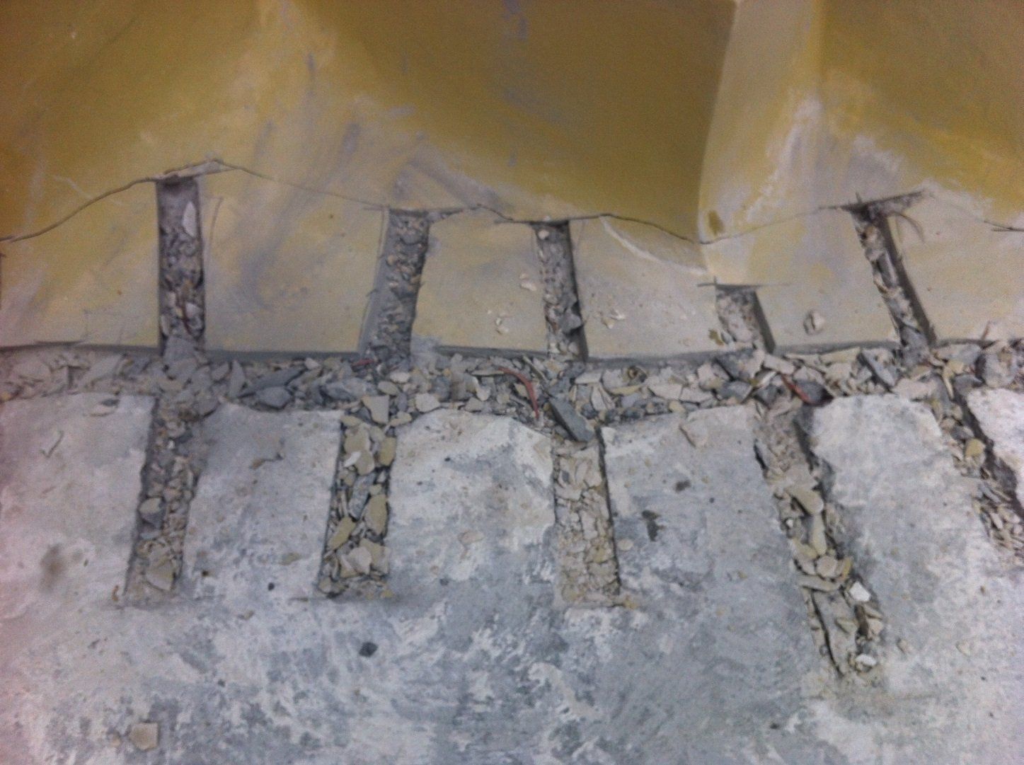 Groves in renovated resurfacing pool coated with water proofing compound