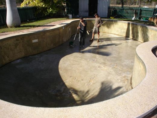 Professional working on the resurfacing of the pool