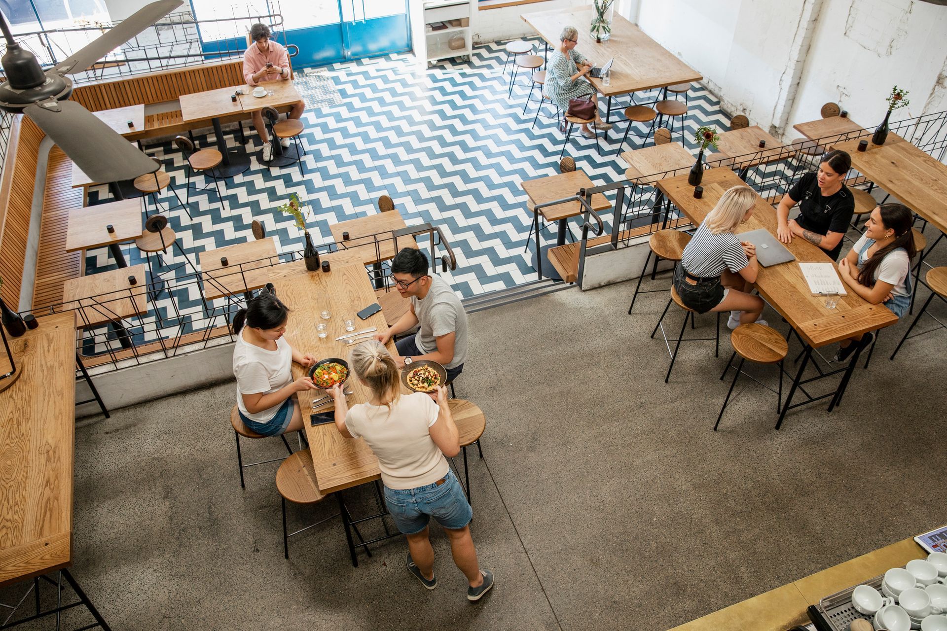 A large empty office with a lot of windows and chairs.