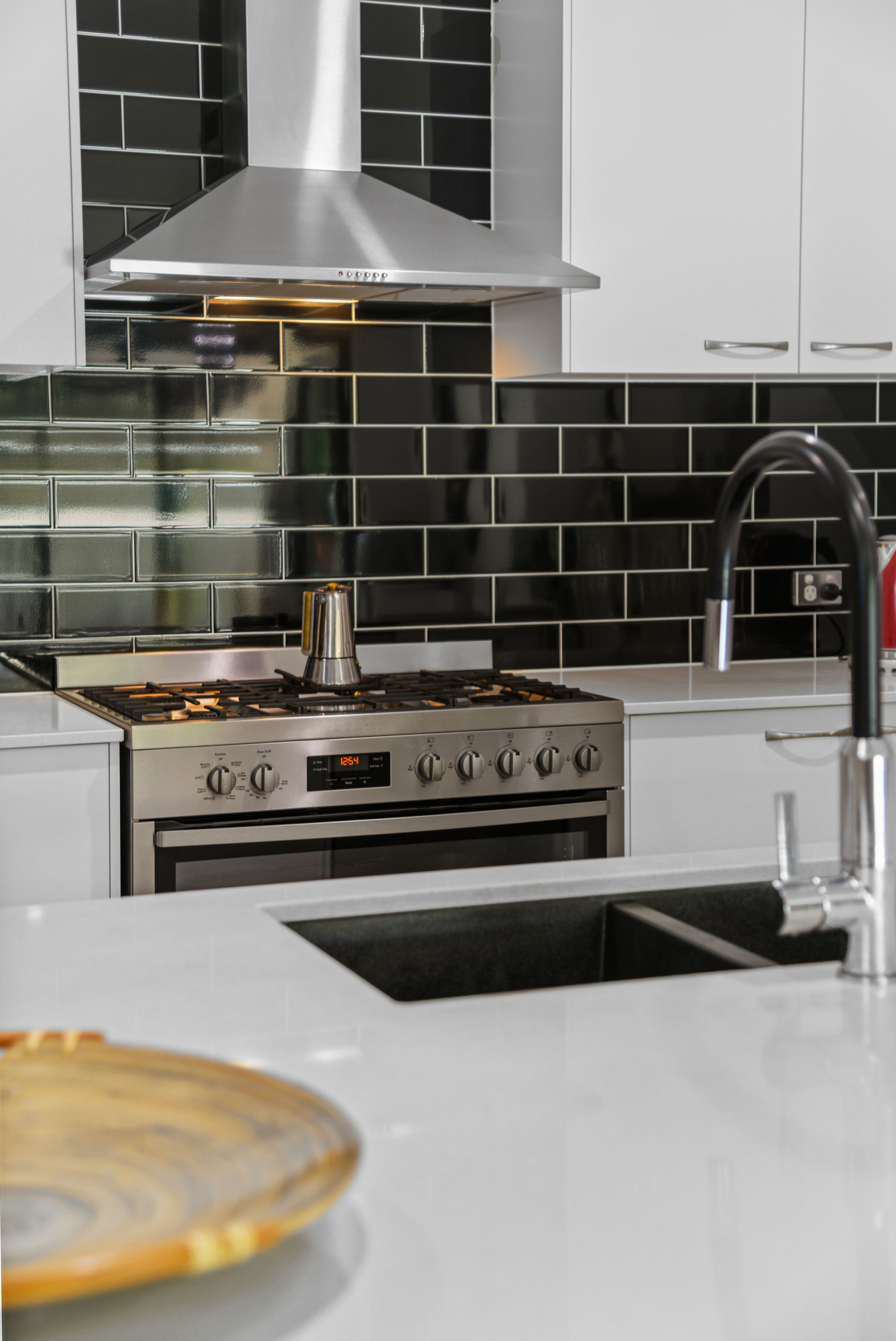 An artist 's impression of a living room and kitchen in a house.