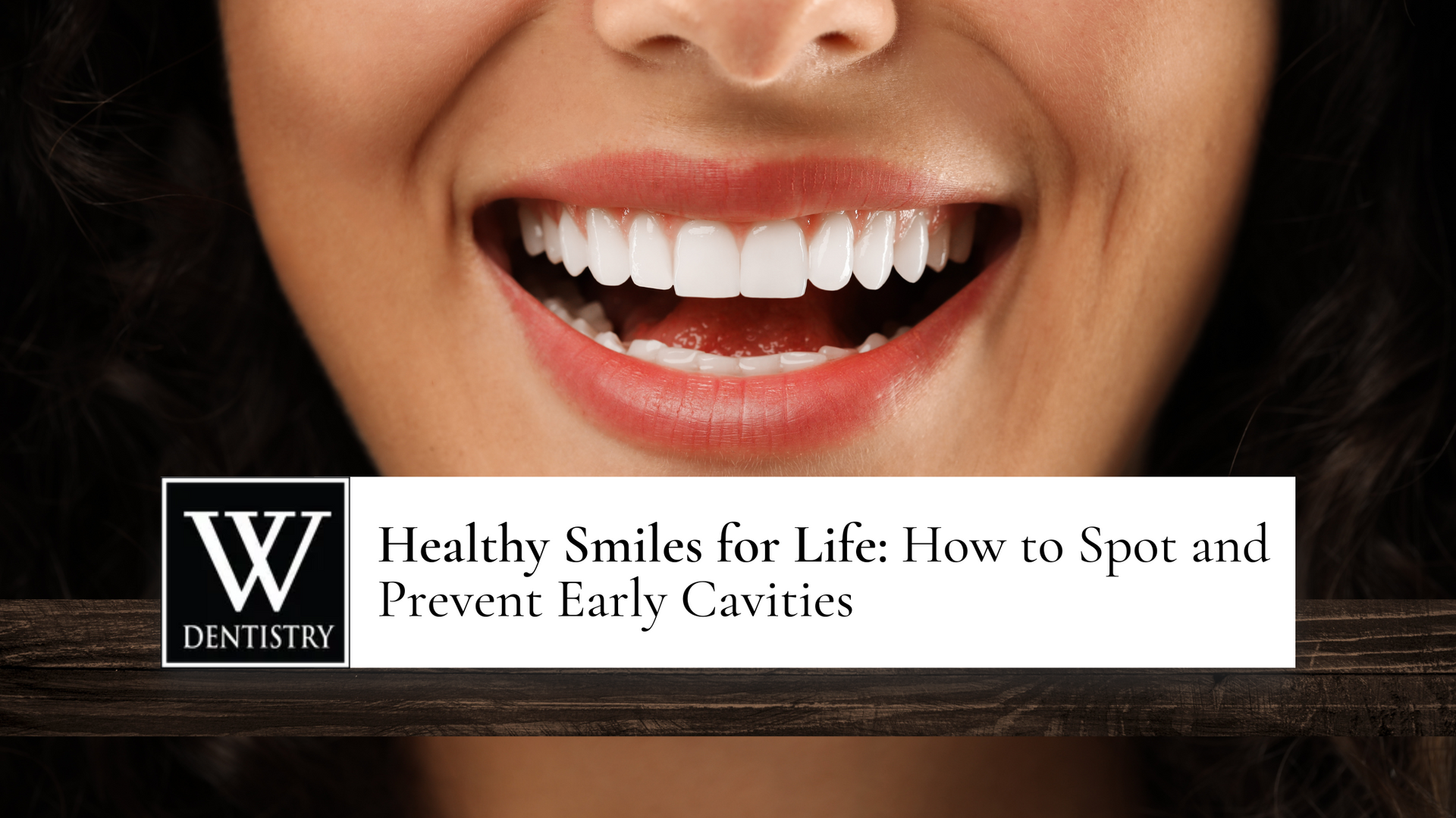 Woman's smiling mouth with white teeth; text reads