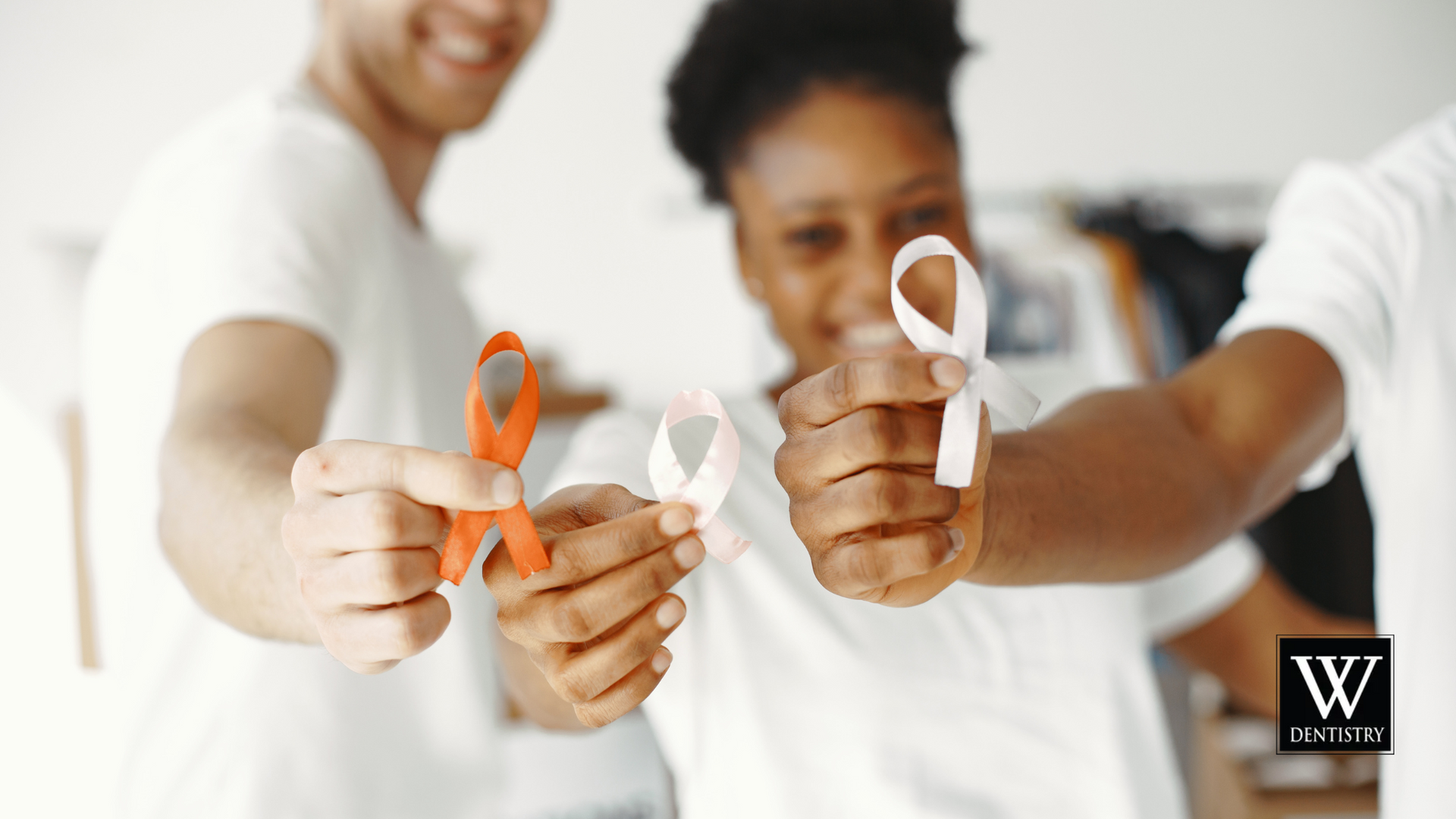 A man and a woman are holding ribbons in their hands.