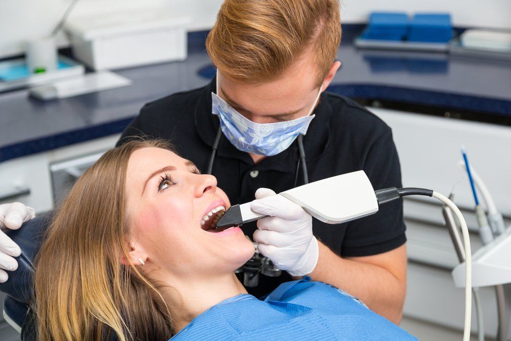 Dental technology | CEREC scanner | dentist near you | dentist scanning a patients mouth with a 3d scanner for cerec | Woo Dental | Best Dentist in Newmarket, ON