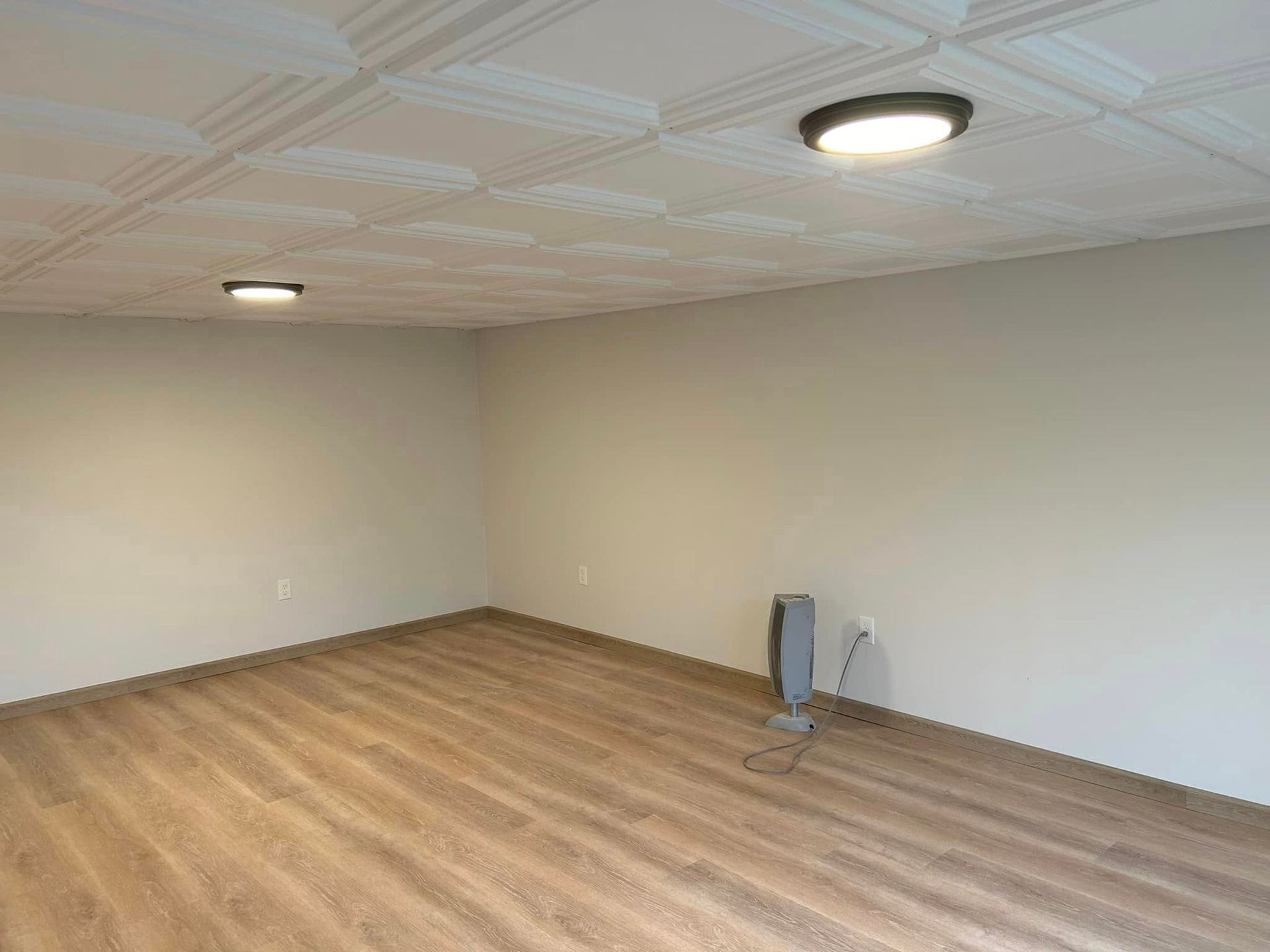 There is a fan in the middle of the room.