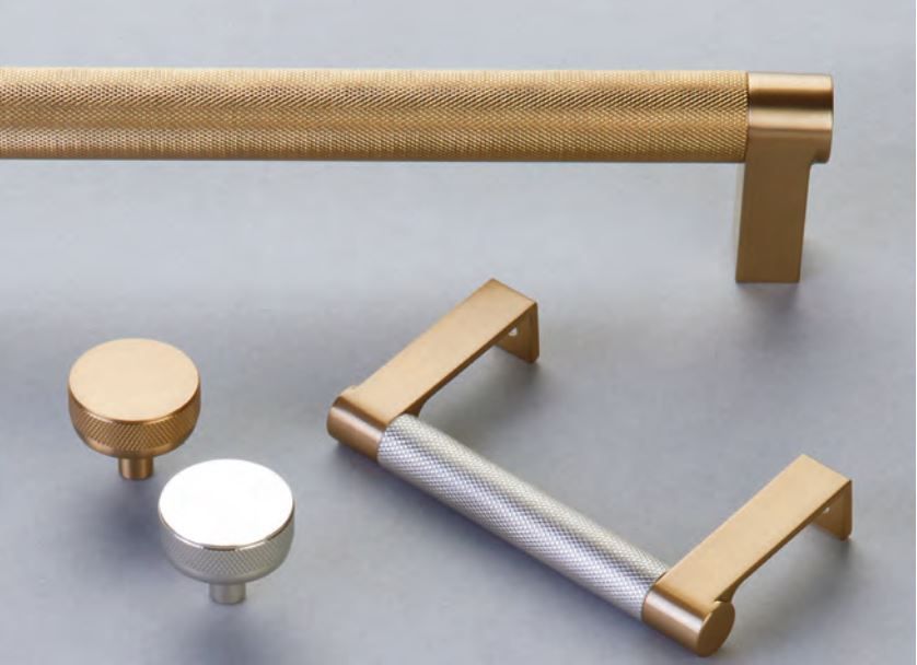 Cabinet hardware: gold and silver knobs and pulls.