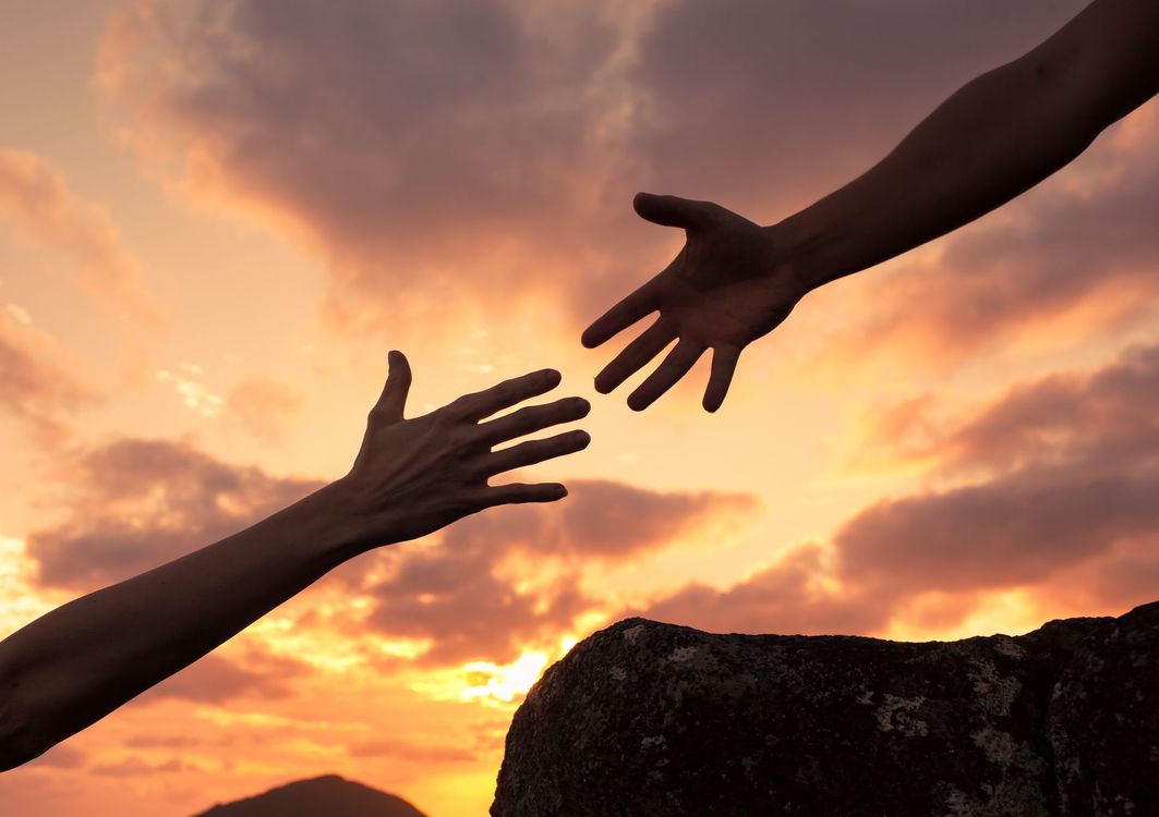 Woman smiling, wearing a headband and white tank top, outdoors in sunlight. Woman smiling, wearing a headband and white tank top, outdoors in sunlight.