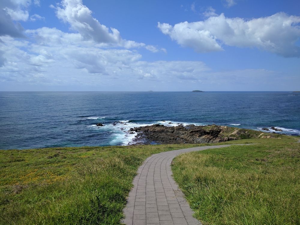 A Path Leading To The Ocean On A Sunny Day — Boambee Home Improvements in Woolgoolga, NSW