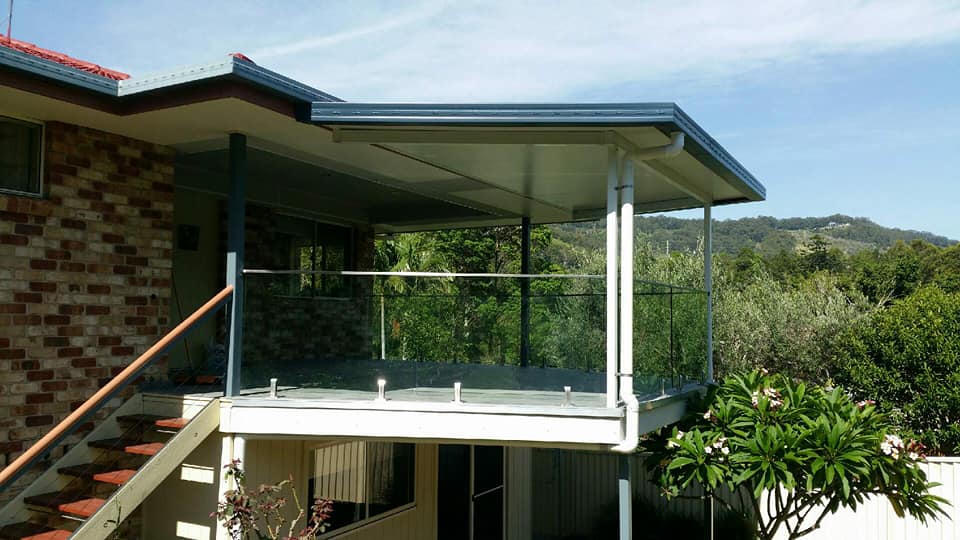 A House With A Balcony And Stairs Leading Up To It — Boambee Home Improvements in Coffs Harbour, NSW