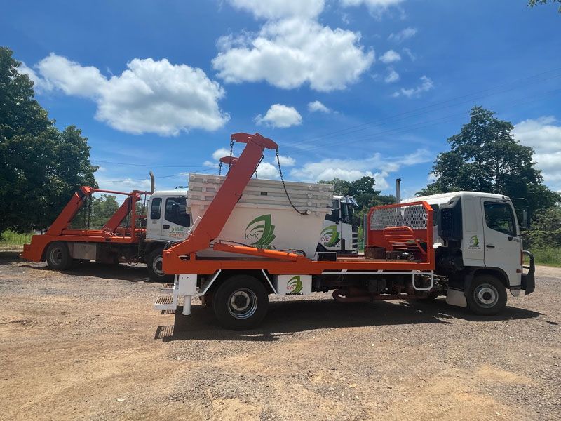 Trucks Parked With Skip Bin — KYK Industries in Katherine, NT