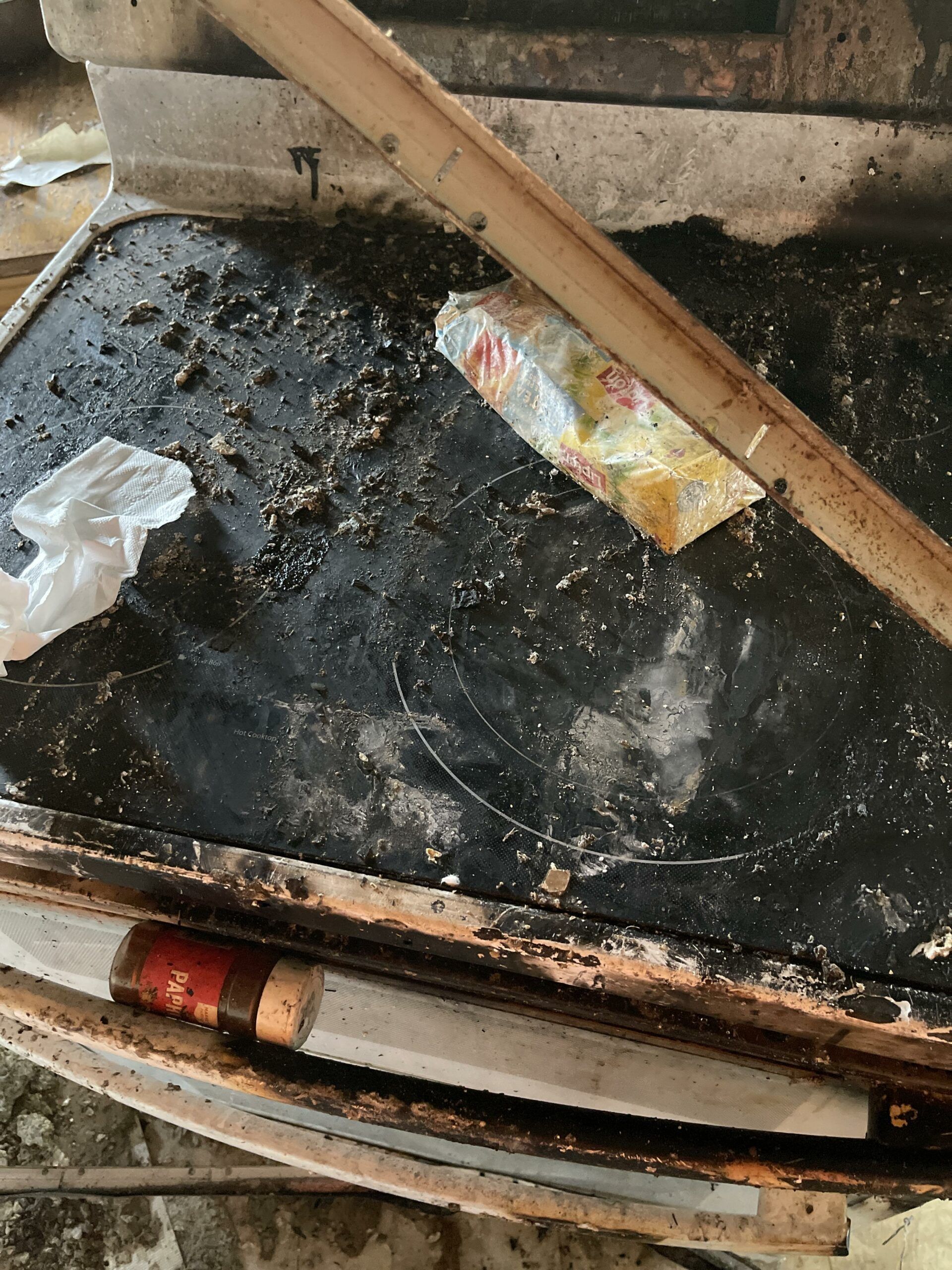 A pile of trash is sitting on top of a wooden table.
