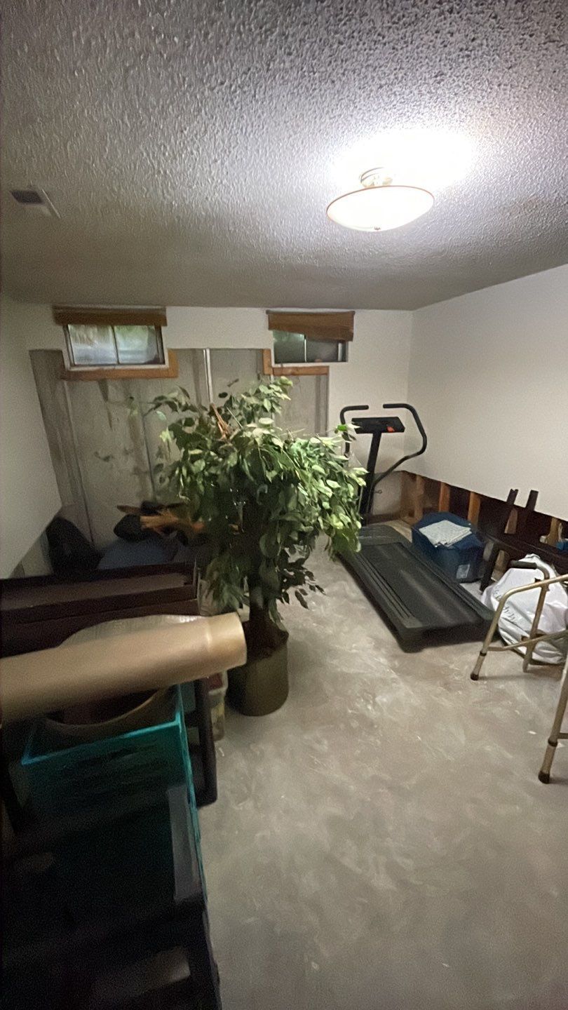 There is a treadmill in the middle of the room.