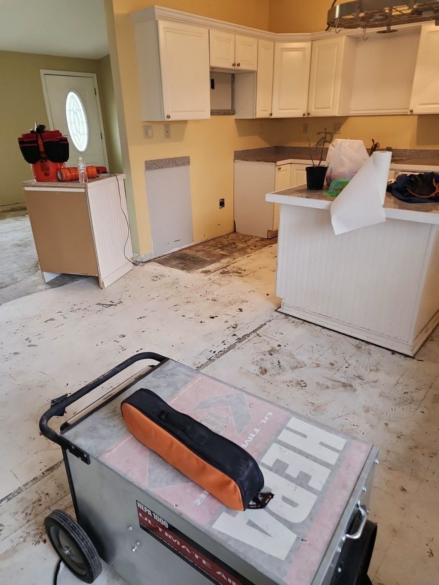 A box with the word hepa on it is in a kitchen.