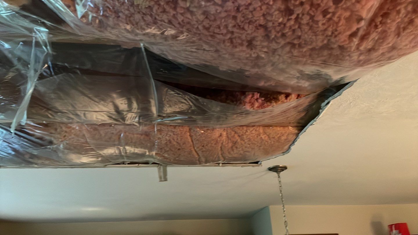 A room with a ceiling that is covered in plastic.