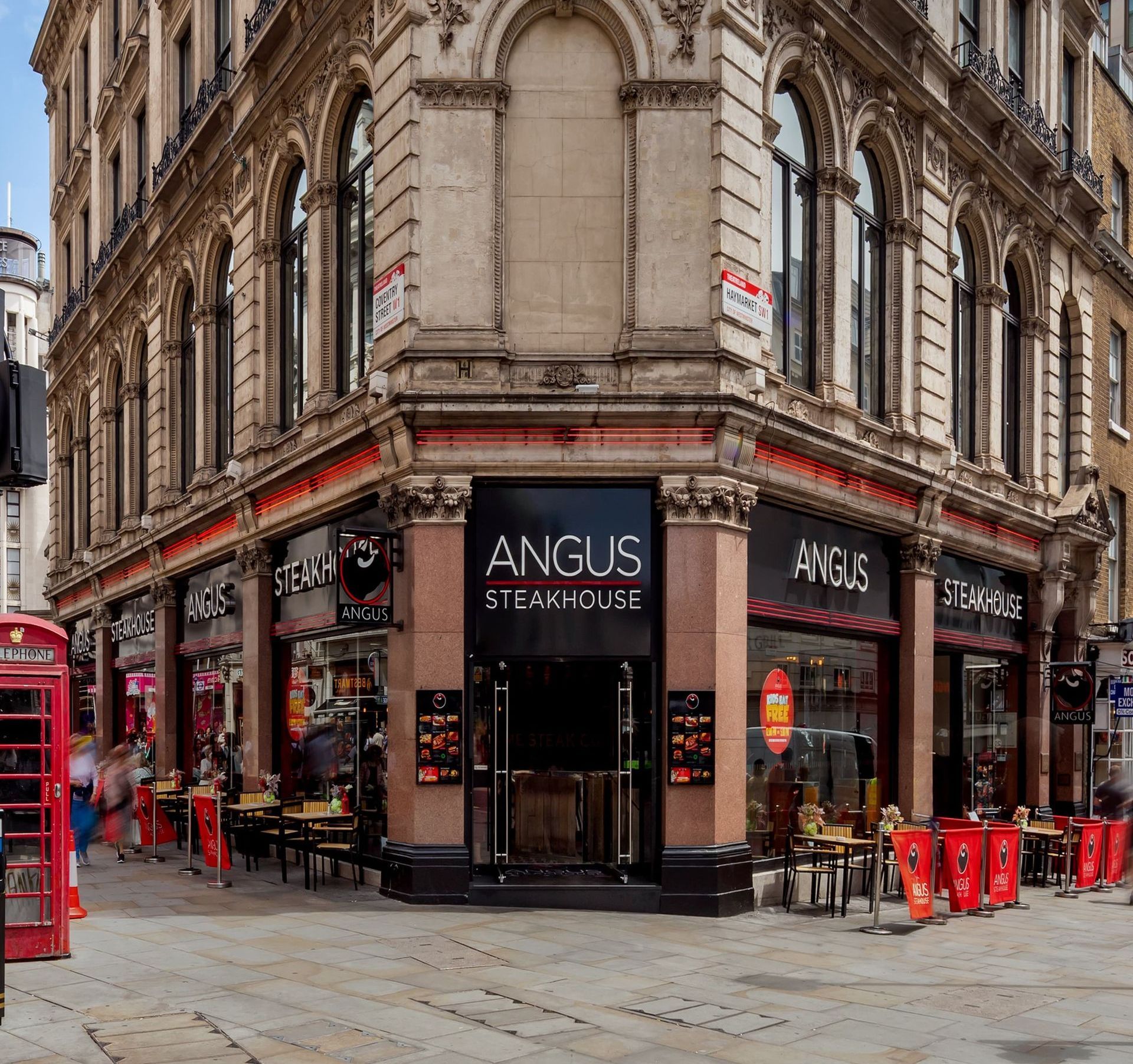 Angus steakhouse is located on the corner of a building