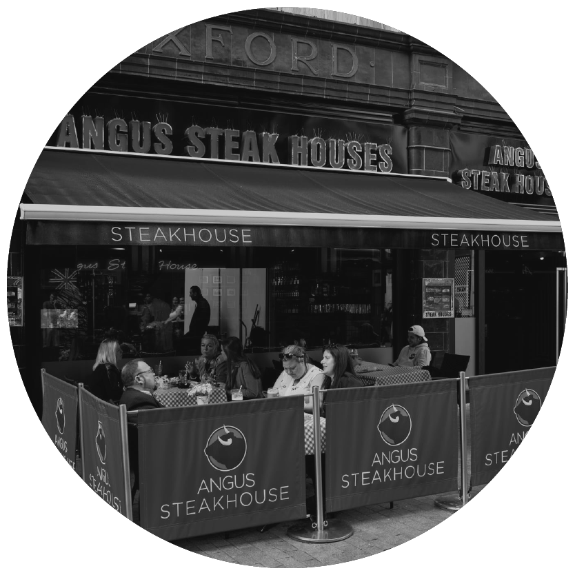 A black and white photo of angus steak houses