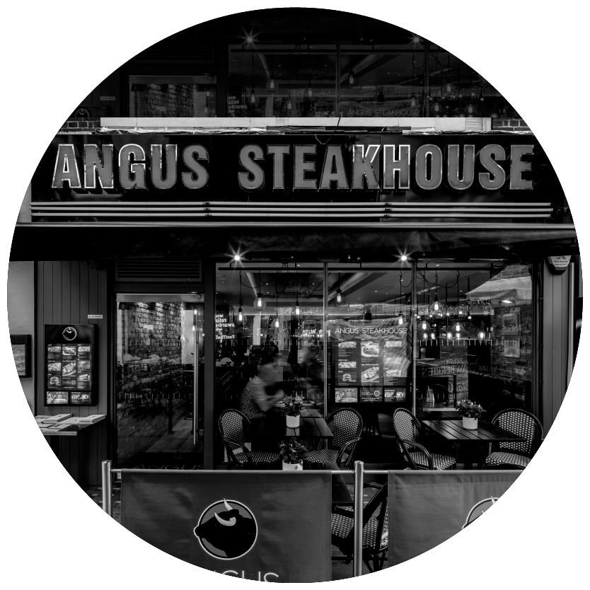 A black and white photo of the angus steakhouse